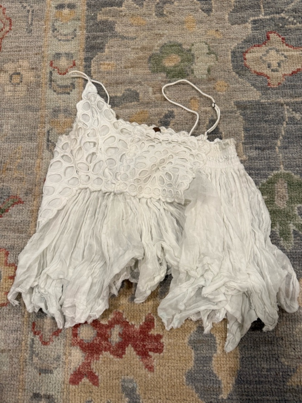 Free People white eyelet crop top with brown branded button